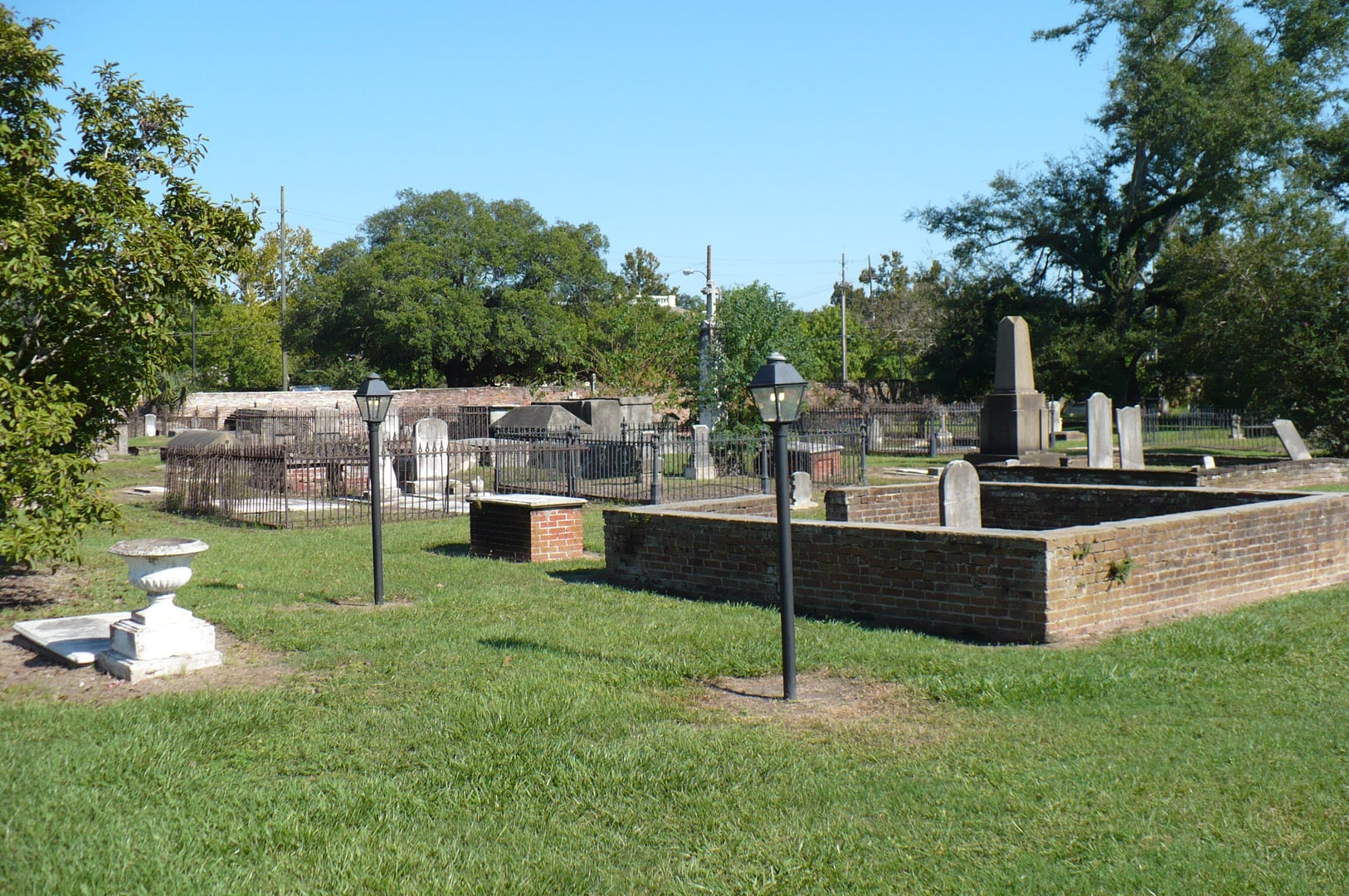 Brick walls and gravestones within Church Street Graveyard in Mobile, Alabama
