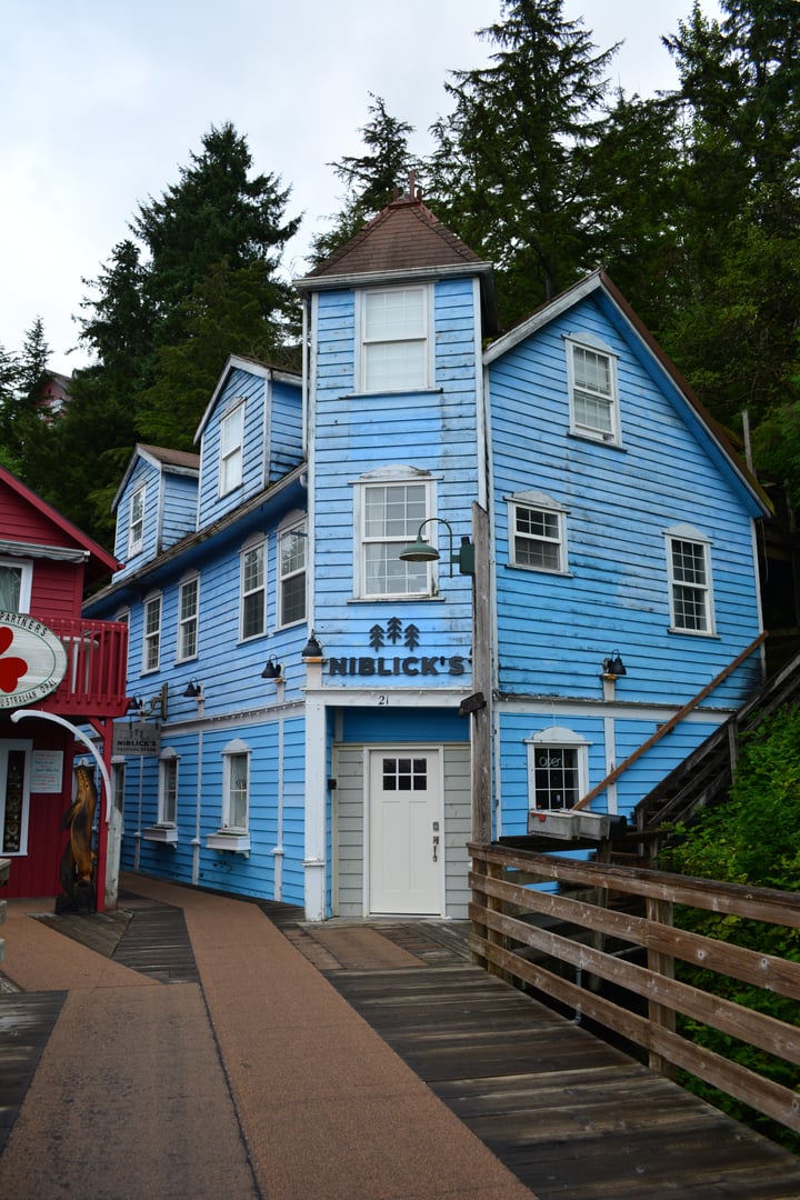 The Creek Street boardwalk on pilings over Ketchikan Creek in Ketchikan, Alaska.