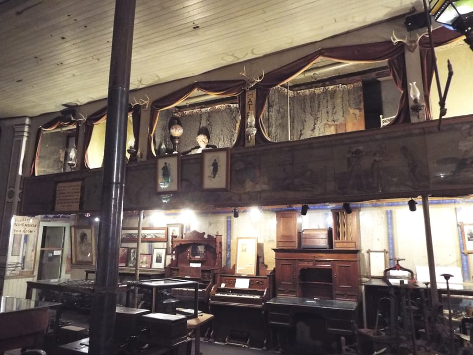 The Bird Cage Theatre's curtained balcony boxes -- the 'bird cage' the venue is named for -- overlooking the saloon floor in Tombstone, Arizona.