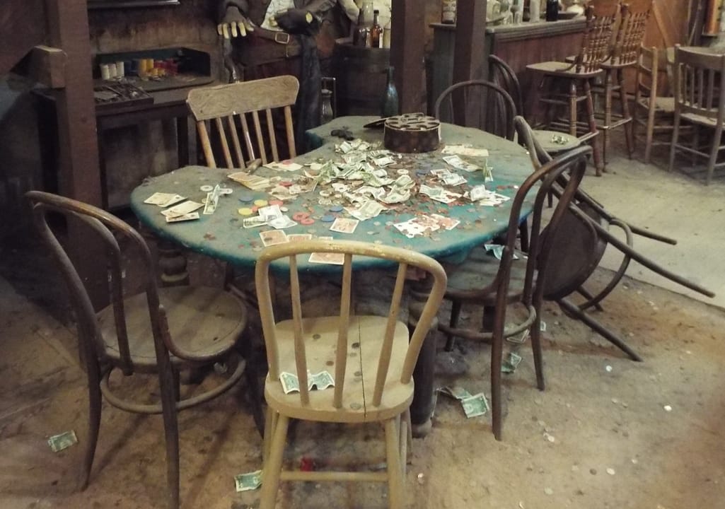 The historic poker table in the Bird Cage Theatre's basement, Tombstone, Arizona -- site of what is billed as the longest poker game in history, played from 1881 to 1890.