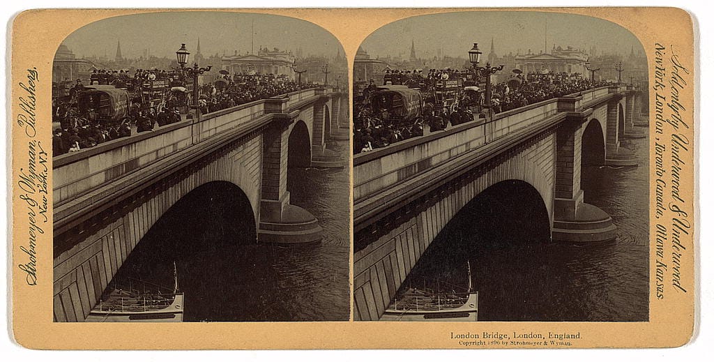 A Victorian-era stereograph card (copyright 1896) showing John Rennie's London Bridge crowded with pedestrian and horse-drawn traffic over the River Thames in London, England -- the same structure later dismantled, shipped to Arizona, and rededicated