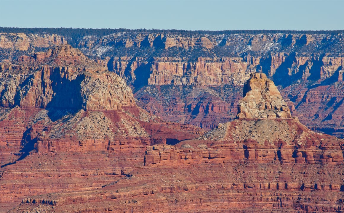 Two rock formations as seen from Rim Drive just west of Grand Canyon Village: Brahma Temple (left) and Zoroaster Temple (right).

Many Grand Canyon rock formations are named after concepts in non-Western religions.