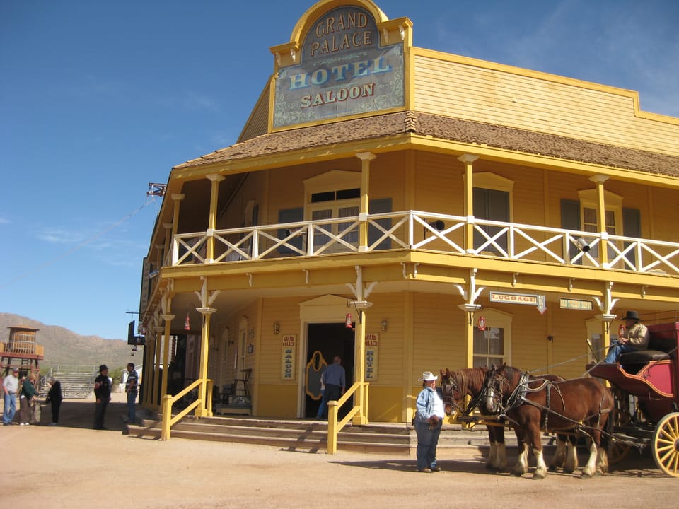 The "Grand Palace Hotel Saloon" set building at Old Tucson Studios, Tucson, Arizona, with a horse-drawn stagecoach out front, February 2009.