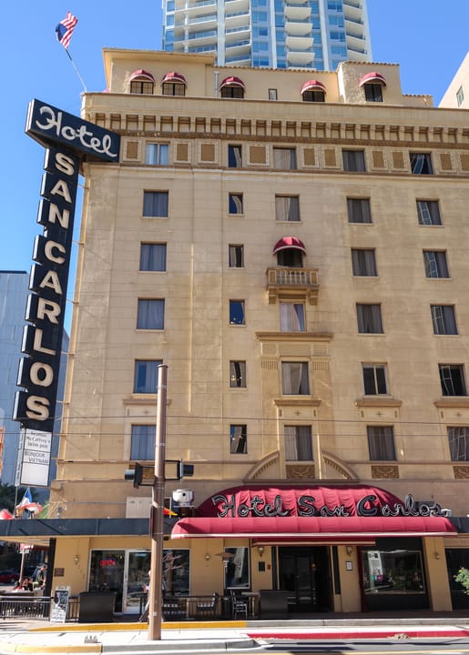 An upward view of the Hotel San Carlos tower and its vertical rooftop sign in downtown Phoenix, December 2013.