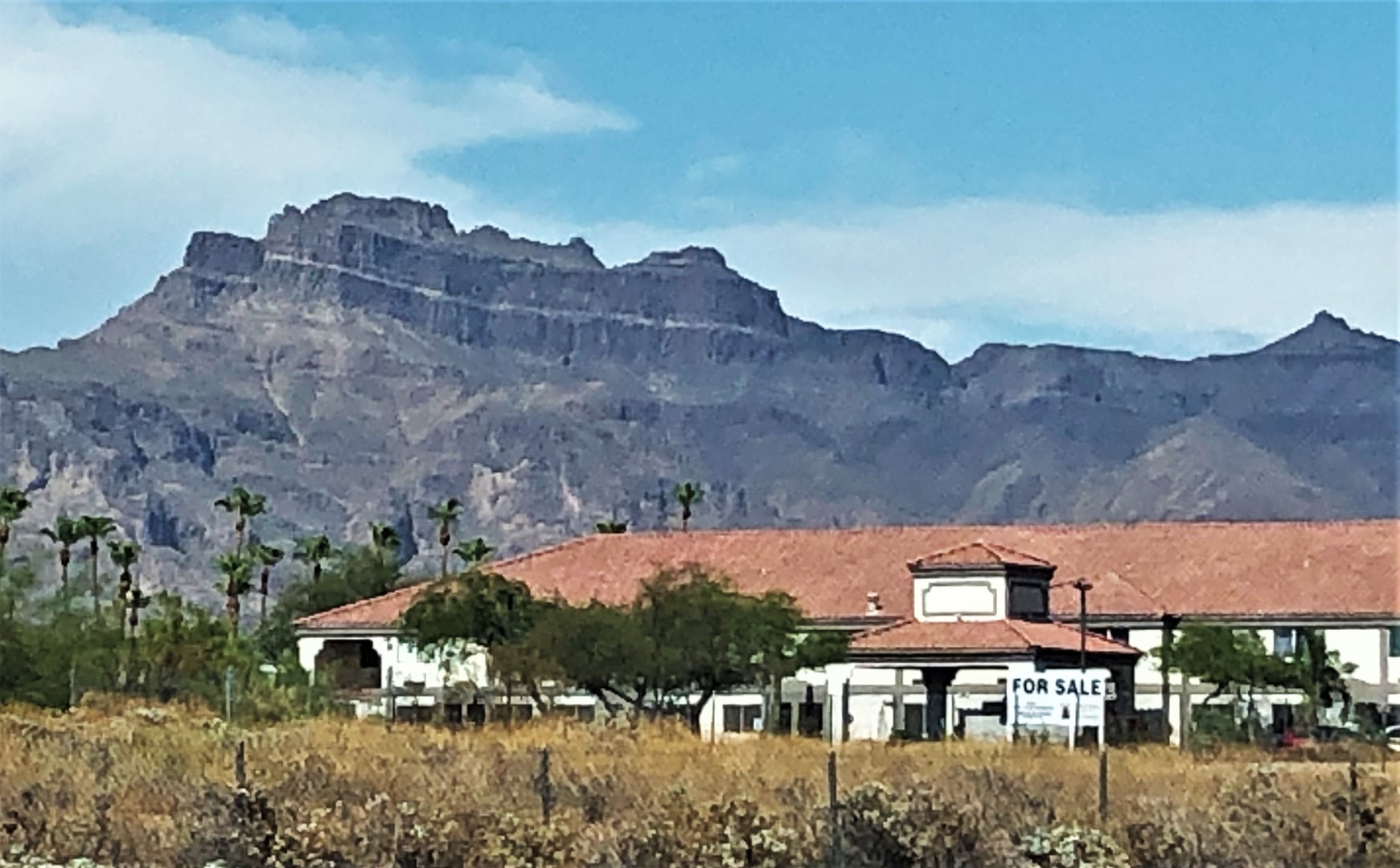 The jagged silhouette of the Superstition Mountains rising above the Sonoran Desert east of Phoenix, Arizona