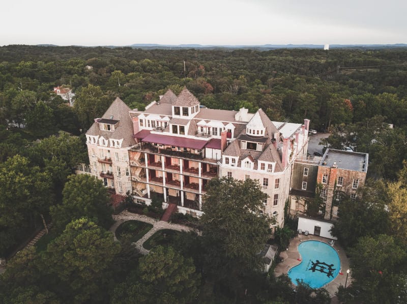 1886 Crescent Hotel exterior in Eureka Springs, Arkansas — historic stone Romanesque Revival hotel viewed from below