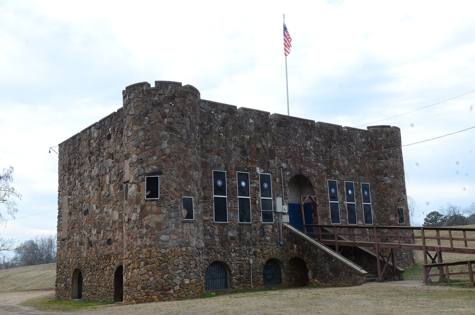 Stone Normanesque castellated facade of the Bunch-Walton Post 22 American Legion Hut in Clarksville, Arkansas, built from native stone in the 1930s
