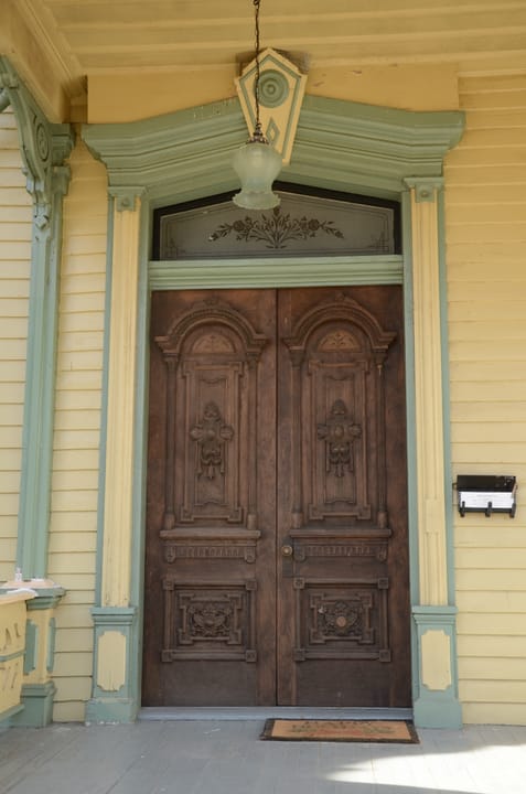 The carved double front door of the Clayton House Museum, Fort Smith, Arkansas.