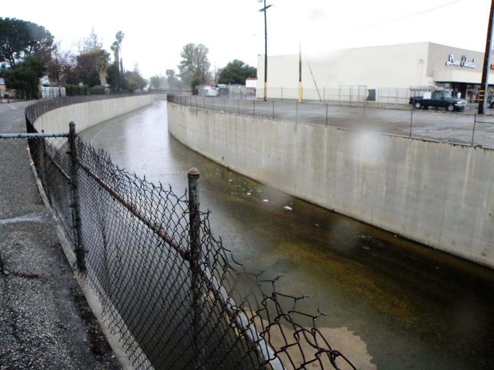 Bell Creek in channelized eastern section, looking upstream (west) from Topanga Canyon Boulevard in Canoga Park within the western San Fernando Valley, Los Angeles. Location is a long block west of the official start of the Los Angeles River, at Bell's confluence with Calabasas Creek.