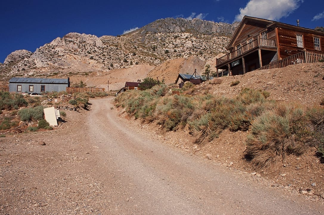 Main street of the silver-mining ghost town of Cerro Gordo, Looking E to mine dumps and Cerro Gordo Peak, Inyo County, CA, USA