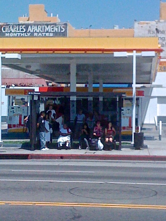 Waiting for the bus on the northeast corner of 3rd Street, just east of Western, Koreatown, Los Angeles.