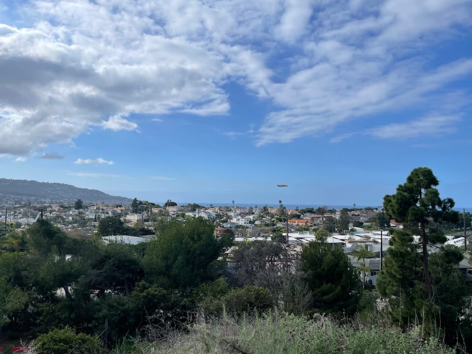 Goodyear blimp flying low over Torrance and Redondo Beach. Photo taken from Hopkins Wilderness park in Redondo Beach.