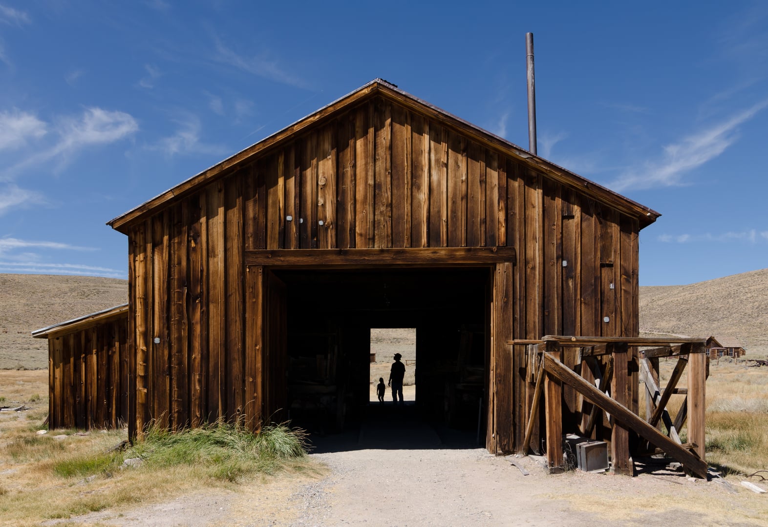 Weathered wooden county barn at Bodie State Historic Park, a preserved 1880s Gold Rush ghost town in Mono County, California