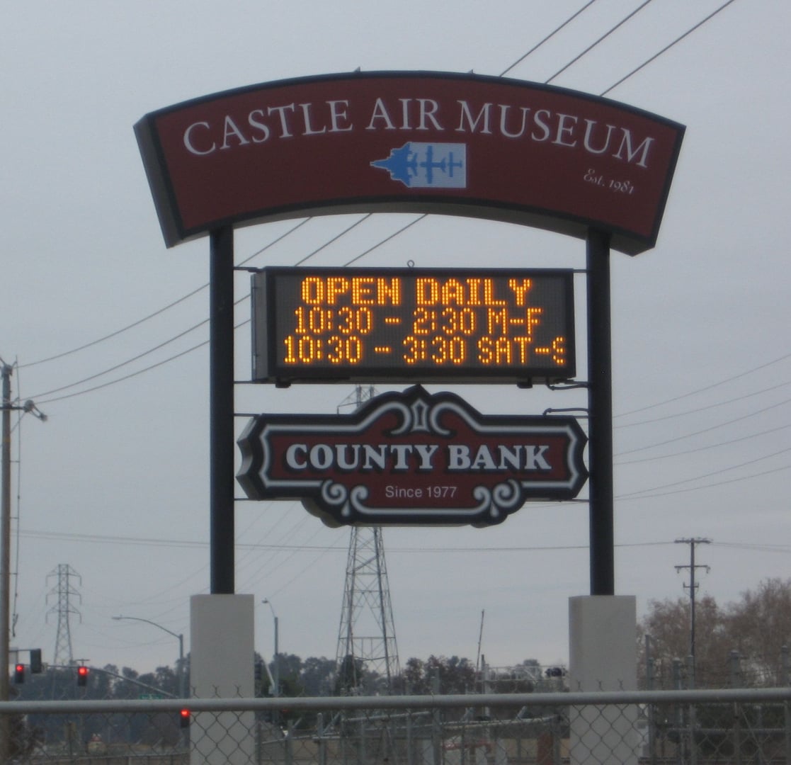 The Castle Air Museum entrance sign at the former Castle Air Force Base in Atwater, California, gateway to the outdoor aviation collection.