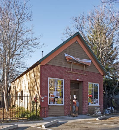 The two-story wood-frame facade of the Georgetown Hotel & Saloon on Main Street in Gold Country California