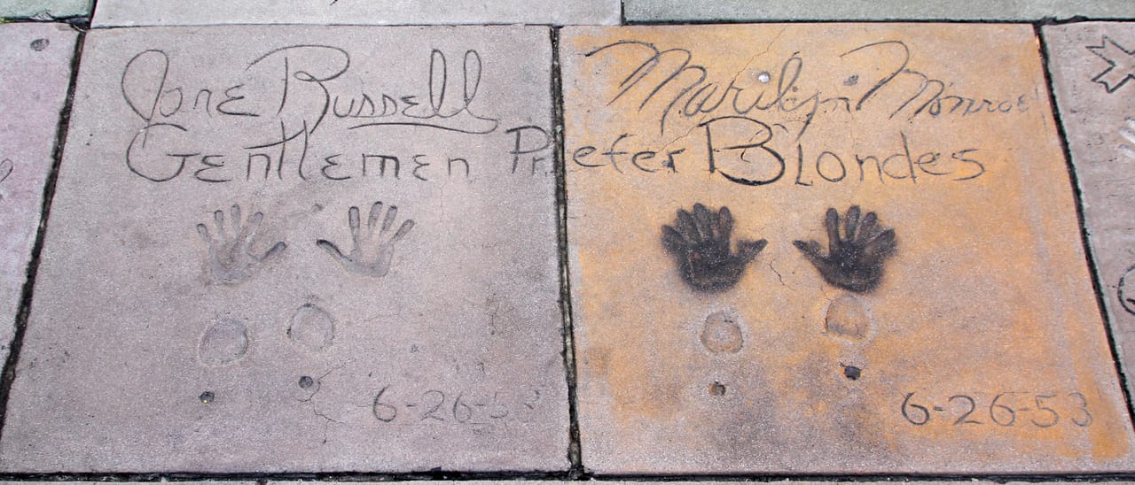 Jane Russell's and Marilyn Monroe's hand- and footprints, pressed into the forecourt cement on 26 June 1953 to promote Gentlemen Prefer Blondes, photographed in 2014.