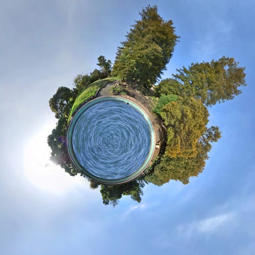 My first attempt at creating one of these stereographic projections of an equirectangular panorama -- a tiny planet. This is from 19 photos shot with a 12mm lens at Joaquin Miller Park in Oakland, CA.

There wasn't really water in the fountain when I shot the originals (thanks cgtextures.com) and I 