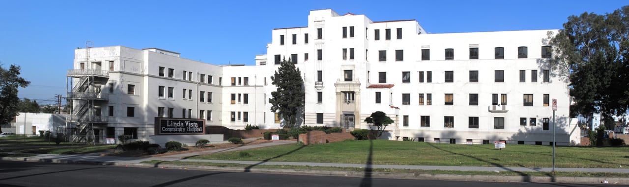 Full street-level panorama of the front of Linda Vista Community Hospital, 610-30 S. Louis Street, Los Angeles, 2012