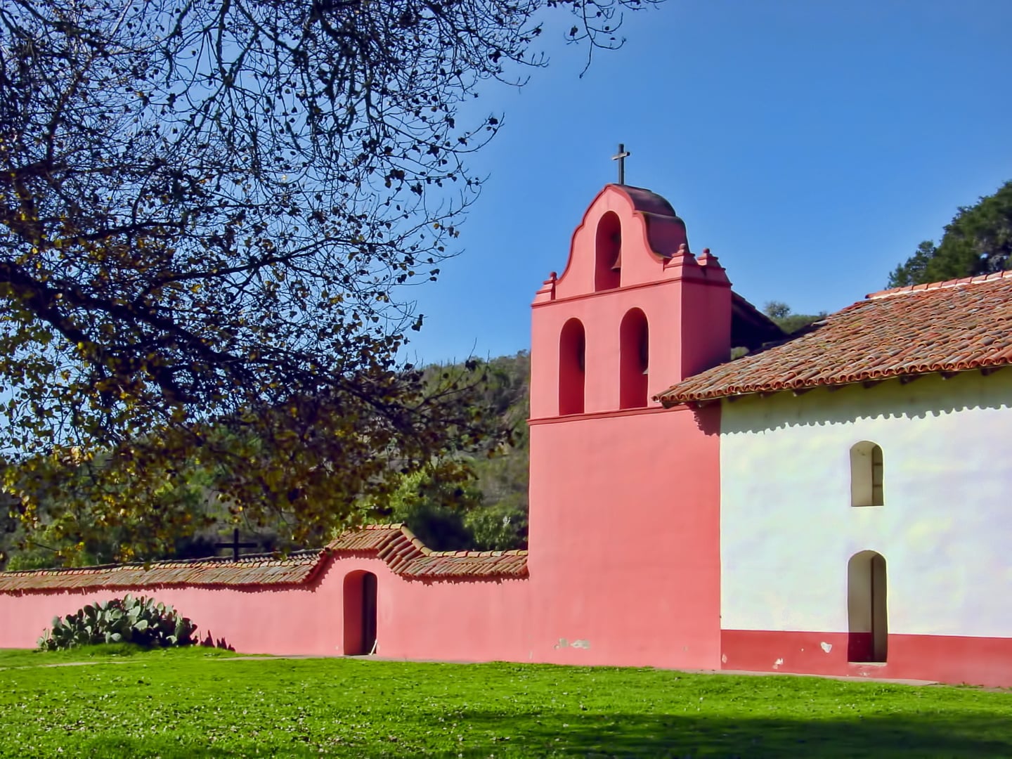 Adobe colonnade and bell tower at La Purisima Mission State Historic Park in Lompoc, California, the most fully restored of the 21 Spanish missions