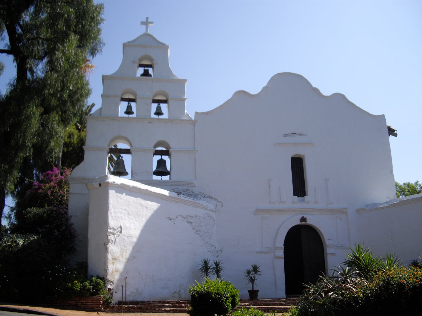 Church of Mission San Diego de Alcalá exterior showing the historic white adobe facade and bell tower