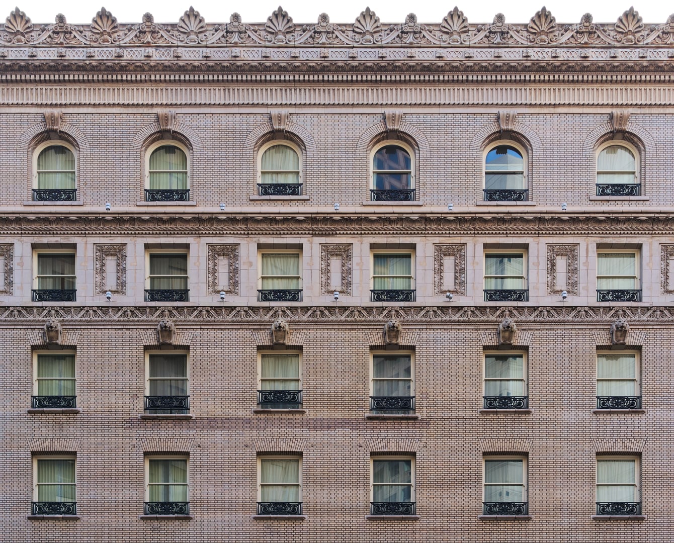 Palace Hotel exterior at 2 New Montgomery Street, San Francisco — Beaux-Arts hotel with the Garden Court glass dome visible