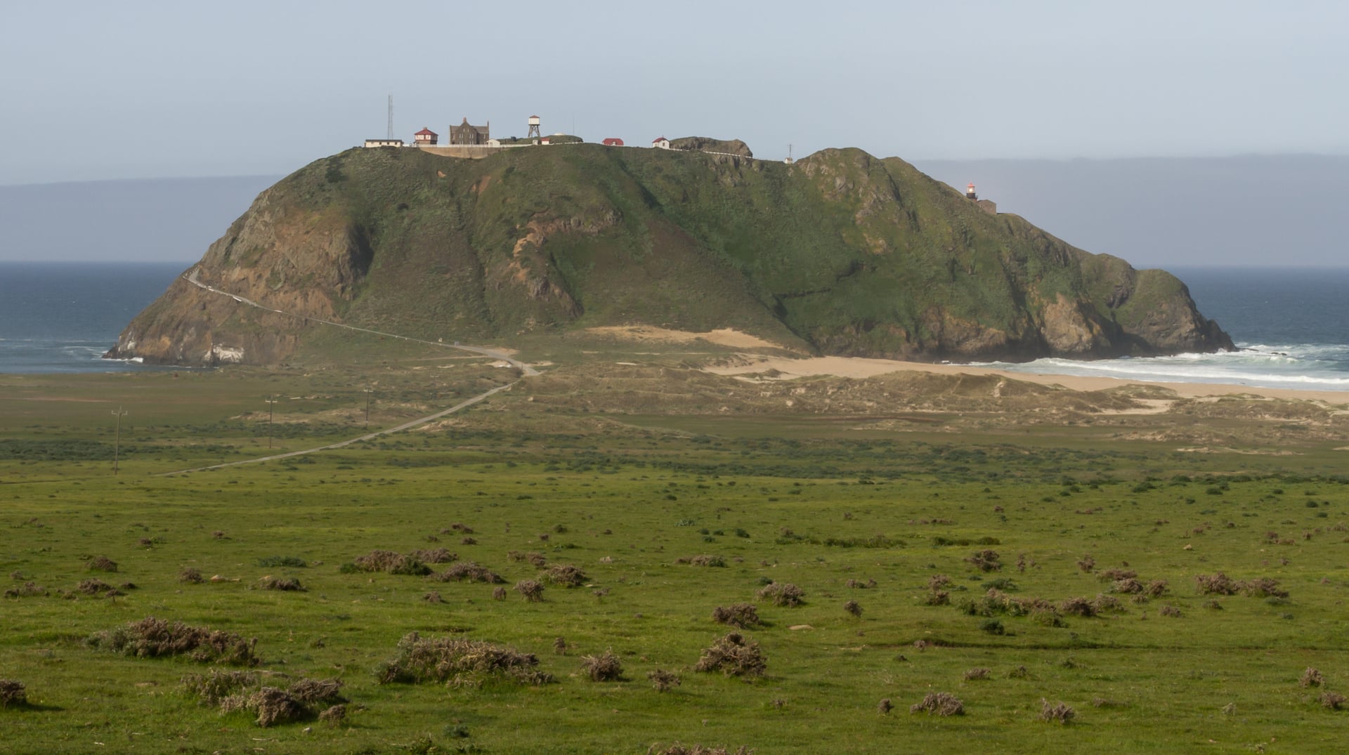 Point Sur Lightstation atop its volcanic rock on the Big Sur coast of California