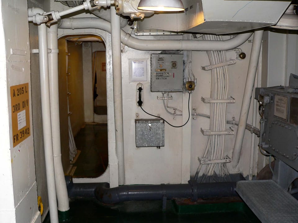 A below-decks corridor aboard USS Hornet (CV-12), part of the museum's self-guided interior route.