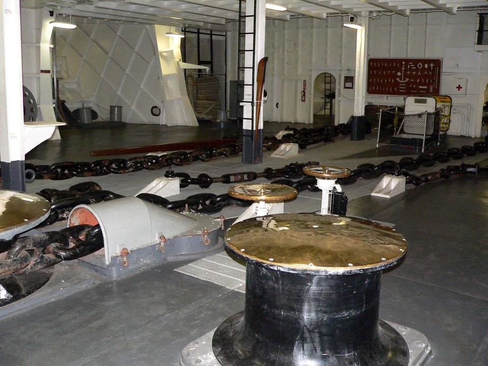The anchor chain locker aboard USS Hornet (CV-12), with chain coiled on deck for the museum display.