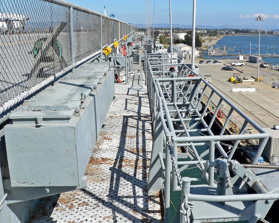 The flight-deck catwalk along the starboard side of USS Hornet (CV-12), overlooking the Alameda waterfront.