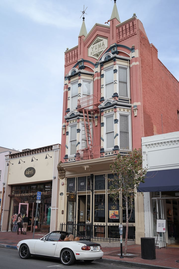 The 1882 Yuma Building's Victorian Italianate brick facade at 631 Fifth Avenue in San Diego's Gaslamp Quarter Historic District