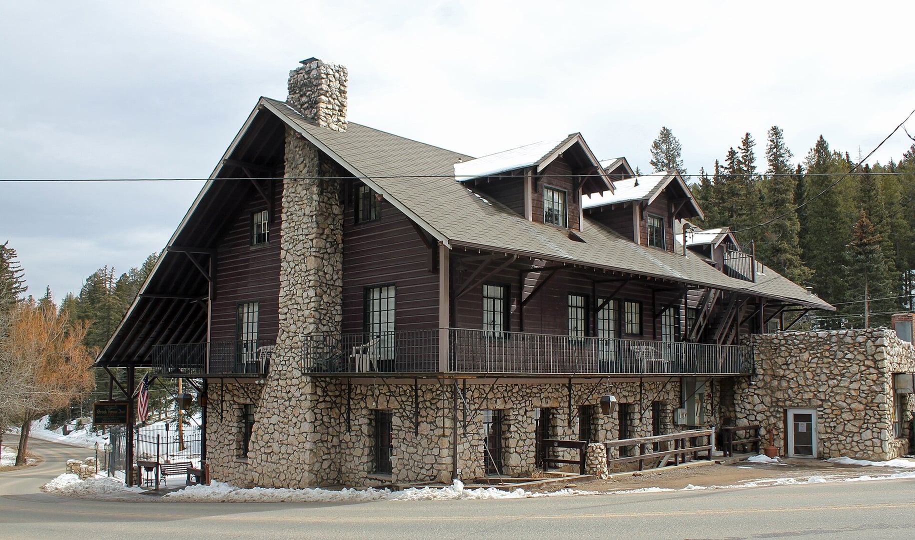 Exterior of Brook Forest Inn at 8136 Brook Forest Road in Evergreen, Colorado, a Swiss chalet and Arts and Crafts style 1909 mountain inn on the National Register of Historic Places