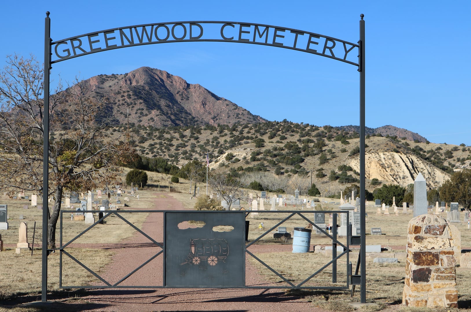 Greenwood Cemetery in Cañon City, Colorado, with YMCA Mountain visible in the background, photographed November 2017