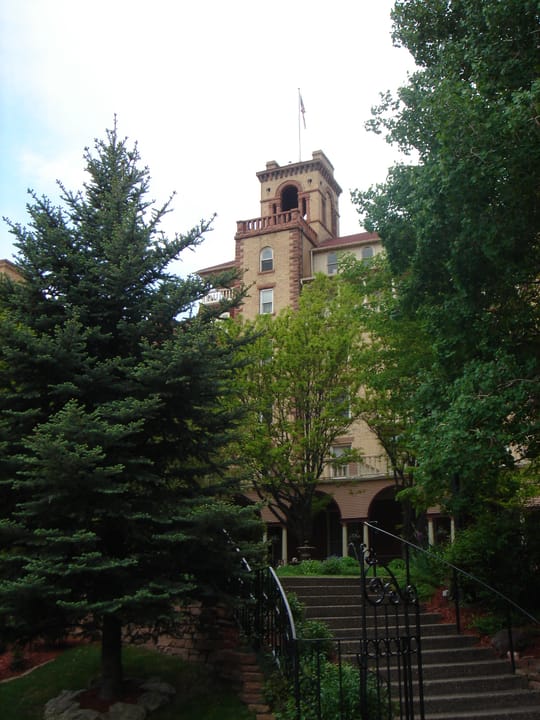 The Hotel Colorado's central tower seen through trees from the front walk, Glenwood Springs, 2007.