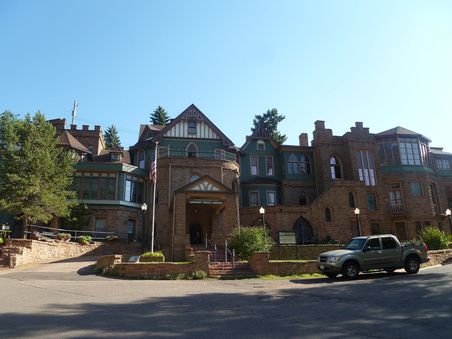 Exterior view of Miramont Castle at 9 Capitol Hill Avenue in Manitou Springs, Colorado, showing the eclectic Victorian stone architecture built in 1895
