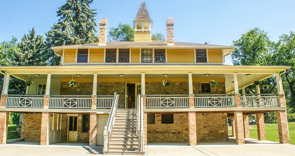 Ground level exterior view of the Montclair Civic Building (Molkerei) in Montclair Park, Denver, Colorado on a sunny day