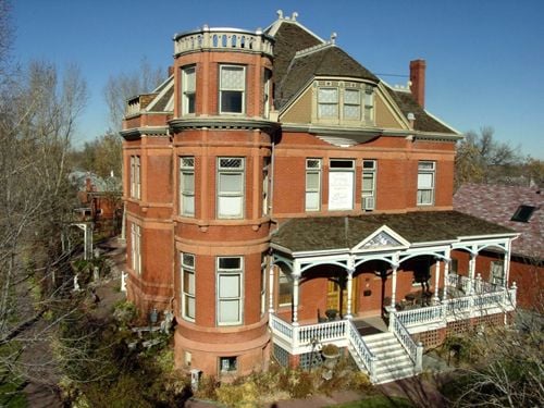 Victorian Queen Anne mansion exterior at 2555 West 37th Avenue in Denver's Potter-Highlands neighborhood