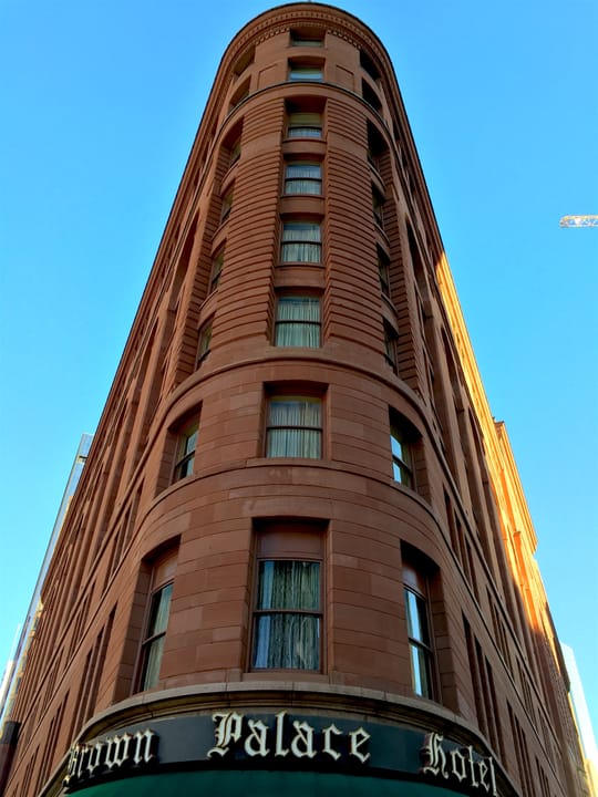 Brown Palace Hotel in Denver Colorado, 1892 triangular red granite hotel with eight-story atrium