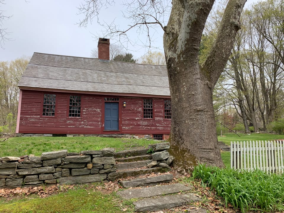 Front view of the 1720 Daniel Benton Homestead, a colonial Cape-style museum house in Tolland, Connecticut