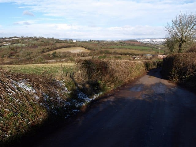 Great Hill Road. The bank on the left is where 1161770 was taken. The lane leads from the busy Barton - Milber ridge road, and Great Hill Cross, and is I think the highest road in Torbay. In the background is the high land north of Torquay between Coffinswell and Rocombe.