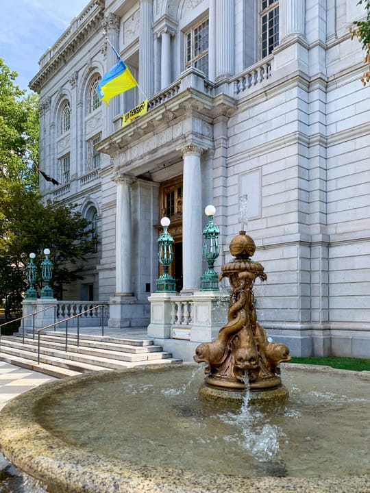 The ornate bronze entrance fountain on the front steps of Hartford City Hall, with the main doors and facade behind it, 2020.