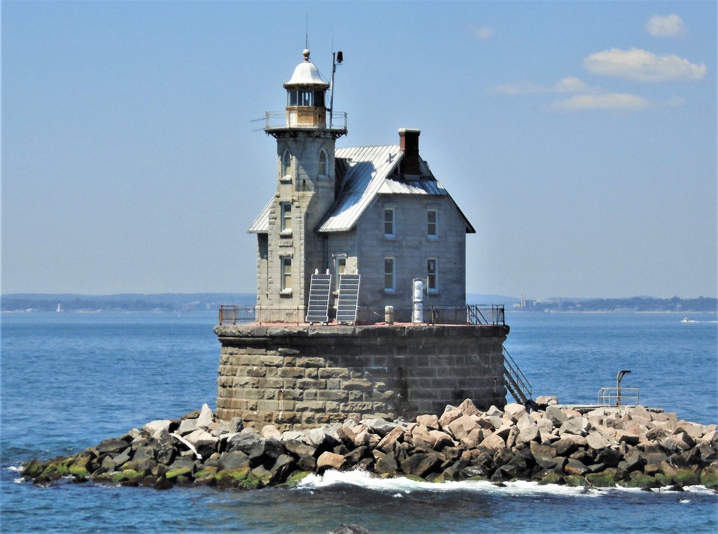 The granite Race Rock Lighthouse rising from its reef foundation in Long Island Sound off New London, Connecticut