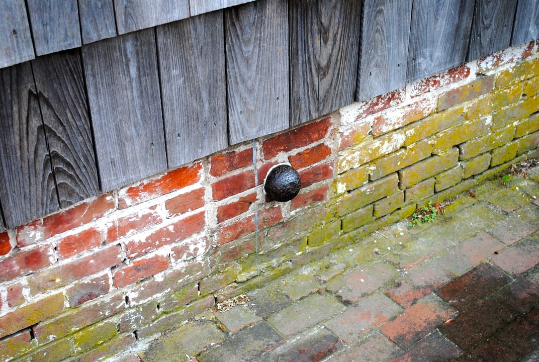 The Cannonball House on Front Street in Lewes, Delaware, the shingled 18th-century building now home to the Lewes Historical Society, seen from the street corner.