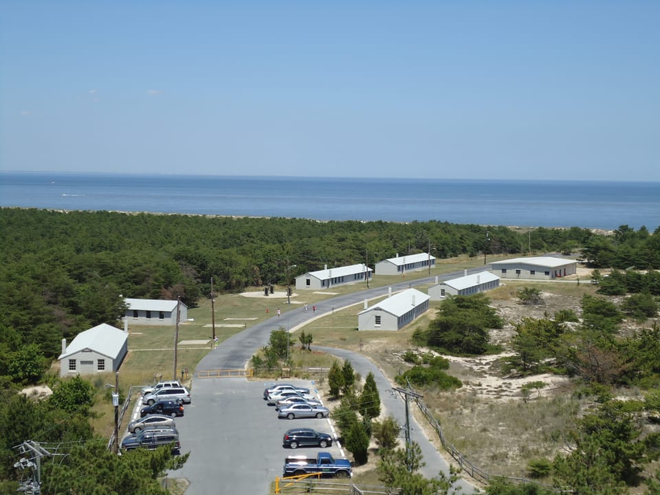 Elevated view from one of Fort Miles's historic fire-control towers over the barracks complex, dunes and the Atlantic, Cape Henlopen State Park.