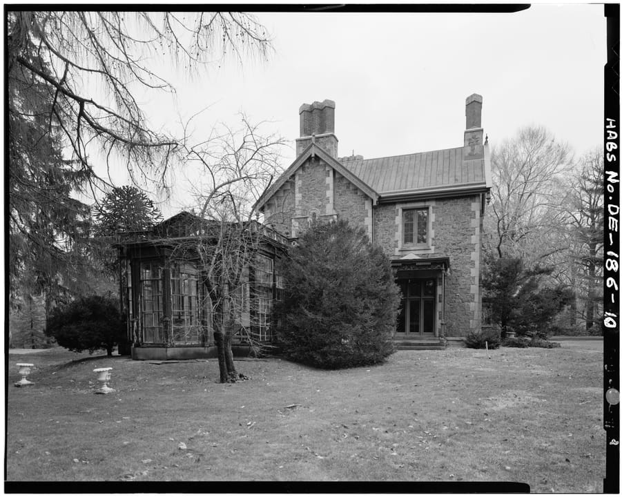 Black-and-white Historic American Buildings Survey photograph of Rockwood's northeast end and glass conservatory, Wilmington, Delaware.