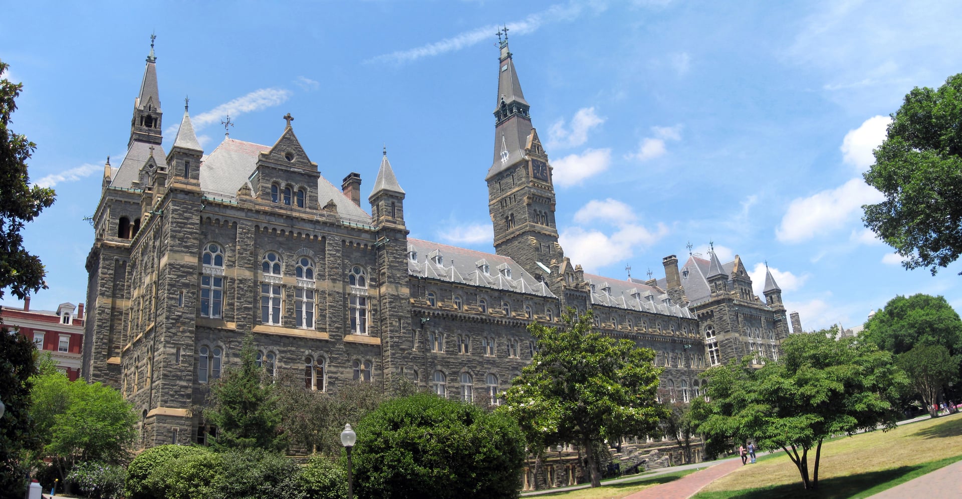 Healy Hall at Georgetown University, a High Victorian Gothic building with a tall clock tower in Washington, DC.