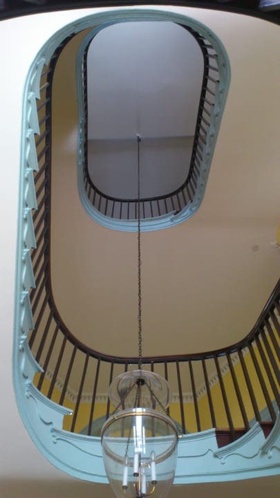 Looking down the Octagon's curved formal staircase from the upper landing.