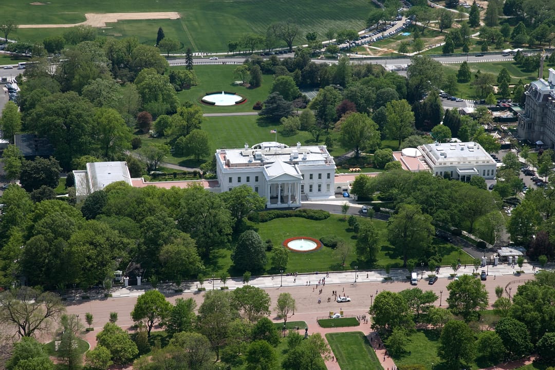 Straight-down aerial view of the White House, West Wing, North and South Lawns and surrounding grounds.