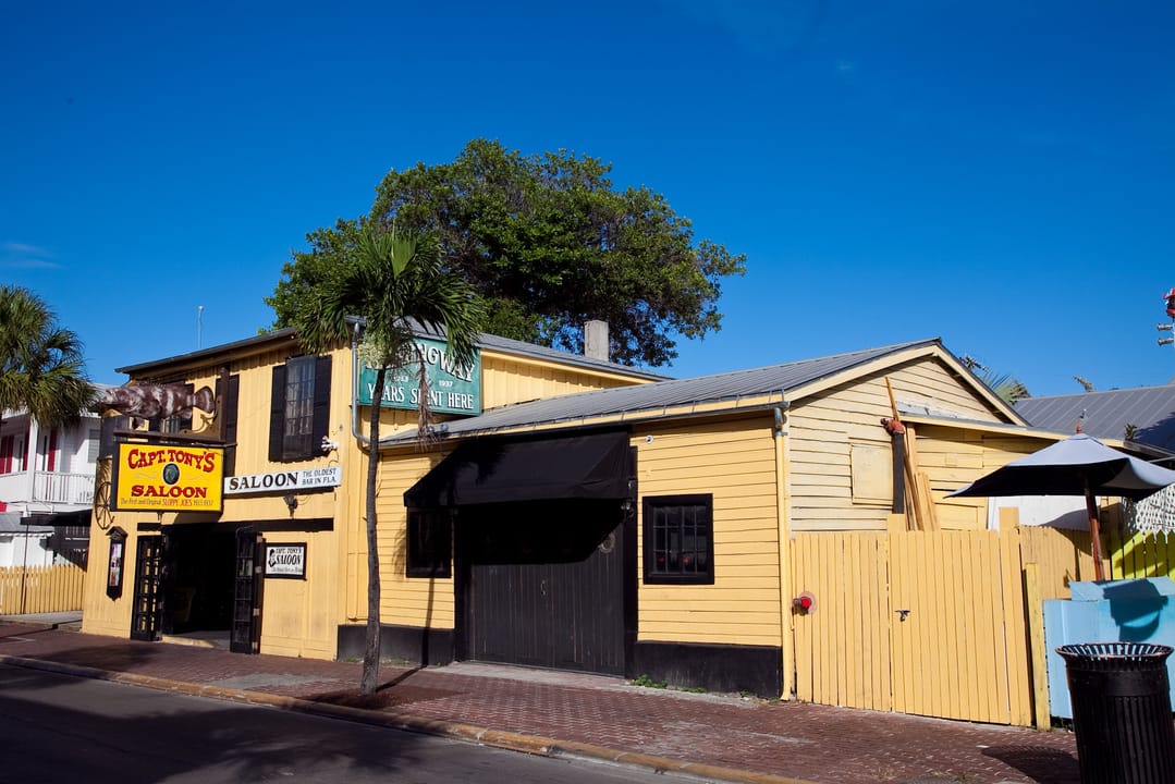 Weathered facade of Captain Tony's Saloon at 428 Greene Street in Key West, Florida — the original Sloppy Joe's Bar location where Hemingway drank in the 1930s.