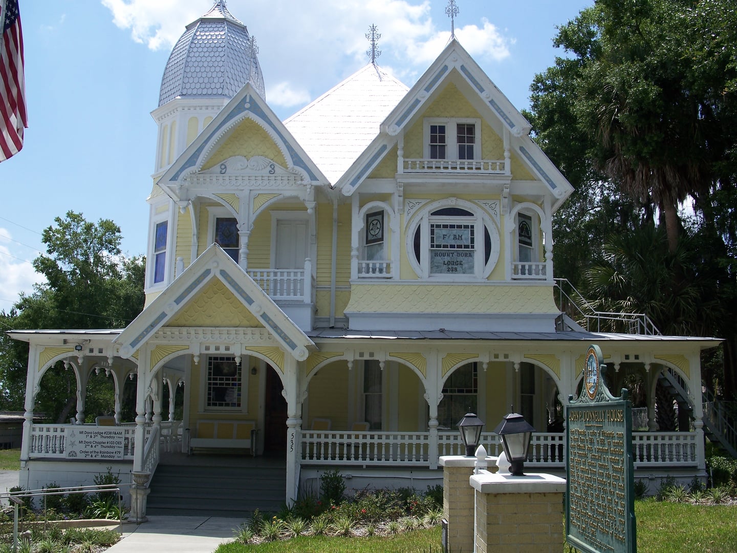 Exterior of the Donnelly House in Mount Dora, Florida, showing the Queen Anne Steamboat Gothic Victorian architecture with prominent tower