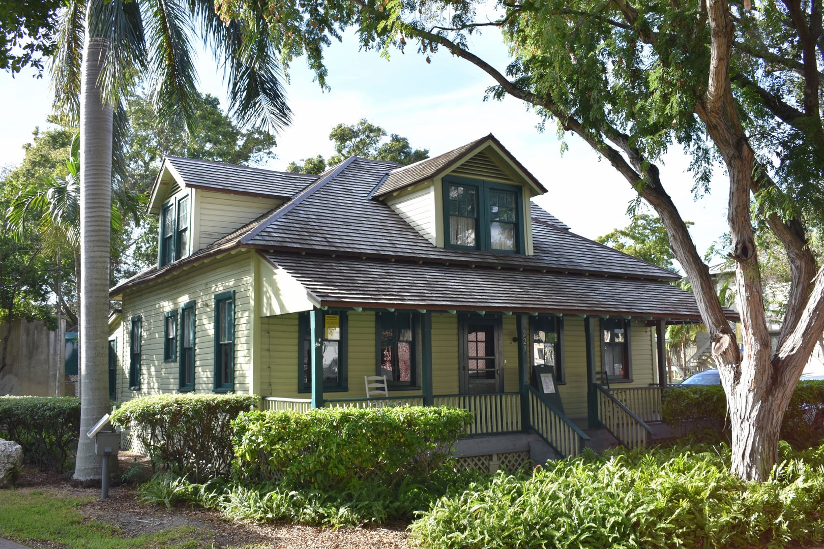 Exterior of the King-Cromartie House in Fort Lauderdale, Florida — a two-story Dade County pine structure built in 1907, part of the Old Fort Lauderdale Village campus
